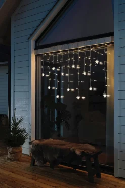 Konstsmide Gardinslinga 12 snöflingor LED 140cm